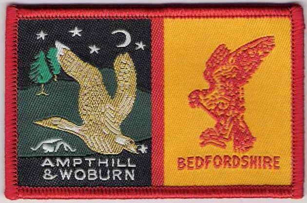 [Ampthill & Woburn @ District Badge]