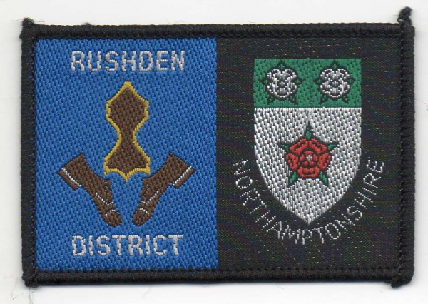 [Rushden @ District Badge]